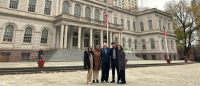 Columbia Nursing students and faculty standing in front of government building